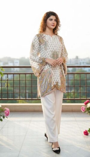 Ivory Paisley Silk Symphony 2-piece set, featuring a stunning silk tunic with gold and teal paisley motifs and matching white wide-leg trousers.