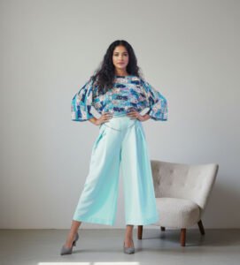 Stellar Glitz Sequence Masterpiece fabric, showcasing exquisite shimmering sequins hand-stitched onto a luxurious micro-mesh base for a radiant finish.