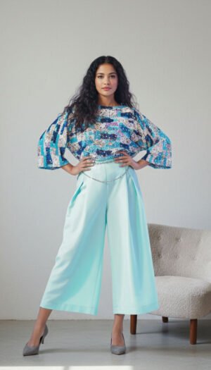 Stellar Glitz Sequence Masterpiece fabric, showcasing exquisite shimmering sequins hand-stitched onto a luxurious micro-mesh base for a radiant finish.