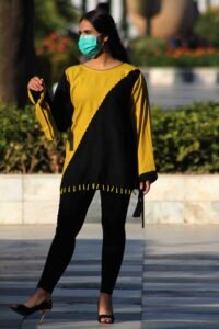 Gilded Ebony Fusion Western kurta, a stunning yellow and black linen piece featuring exquisite hand work and a modern diagonal cut.