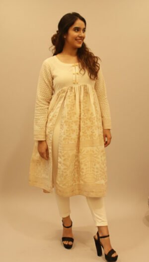 Gilded Ivory Lawn Frock, an exquisite off-white lawn one-piece frock featuring stunning gold block-printed patterns, a pleated empire waist, and radiant textured sleeves.