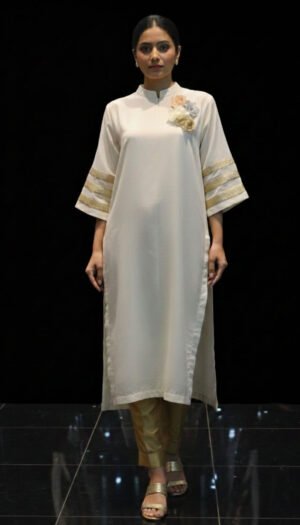 Blossom Bow Ensemble, a stunning 2-piece white kurta featuring exquisite floral hand work on the chest, gold-striped sleeves, and a delicate bow detail on the back.