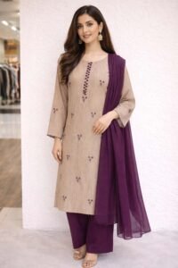 Crimson Filigree Embroidered Suite, a stunning 3-piece vibrant red lawn ensemble featuring exquisite machine embroidery in ivory and gold across the shirt, paired with a sheer radiant shafon dupatta.