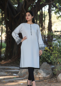 Slate Urban Nomad kurta, a stunning light grey khadder piece featuring exquisite hand work tribal patches on the sleeves and a sleek Western silhouette.