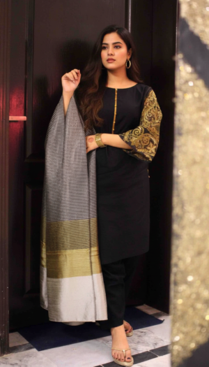 Obsidian Gilded Lawn 3-piece suit, featuring a black lawn kurta with exquisite gold hand work on the sleeves, matching trousers, and a silver and gold striped dupatta.