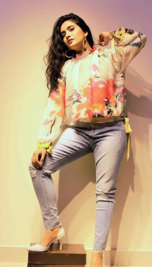 Chromatic Flora Shaffon Shirt, an exquisite white chiffon western shirt with vibrant watercolor floral patterns, a high-neck collar with a side tie, and flowing sleeves.