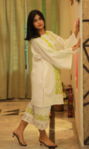 Neon Blossom Lawn Trio, a stunning 3-piece white lawn suit featuring exquisite lime green patch work on the shirt, intricate machine embroidery on the trousers, and matching lime accents