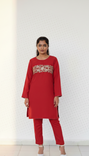 Crimson Hand Worked Aura kurta, a stunning deep red khadder piece featuring exquisite hand work floral motifs across the chest and a sleek tailored silhouette.