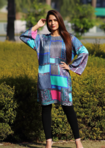 Radiant Mosaic Silk kurta, a stunning multi-colored silk piece featuring exquisite hand work, teal and magenta patchwork, and a modern Western high-neck silhouette.